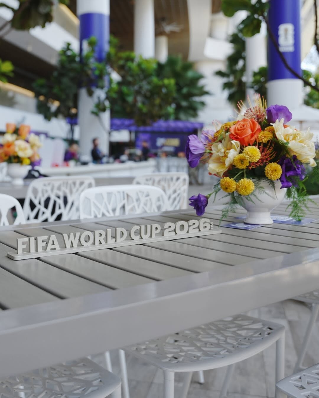 FIFA World Cup 2026 table marker and flowers in a hospitality terrace