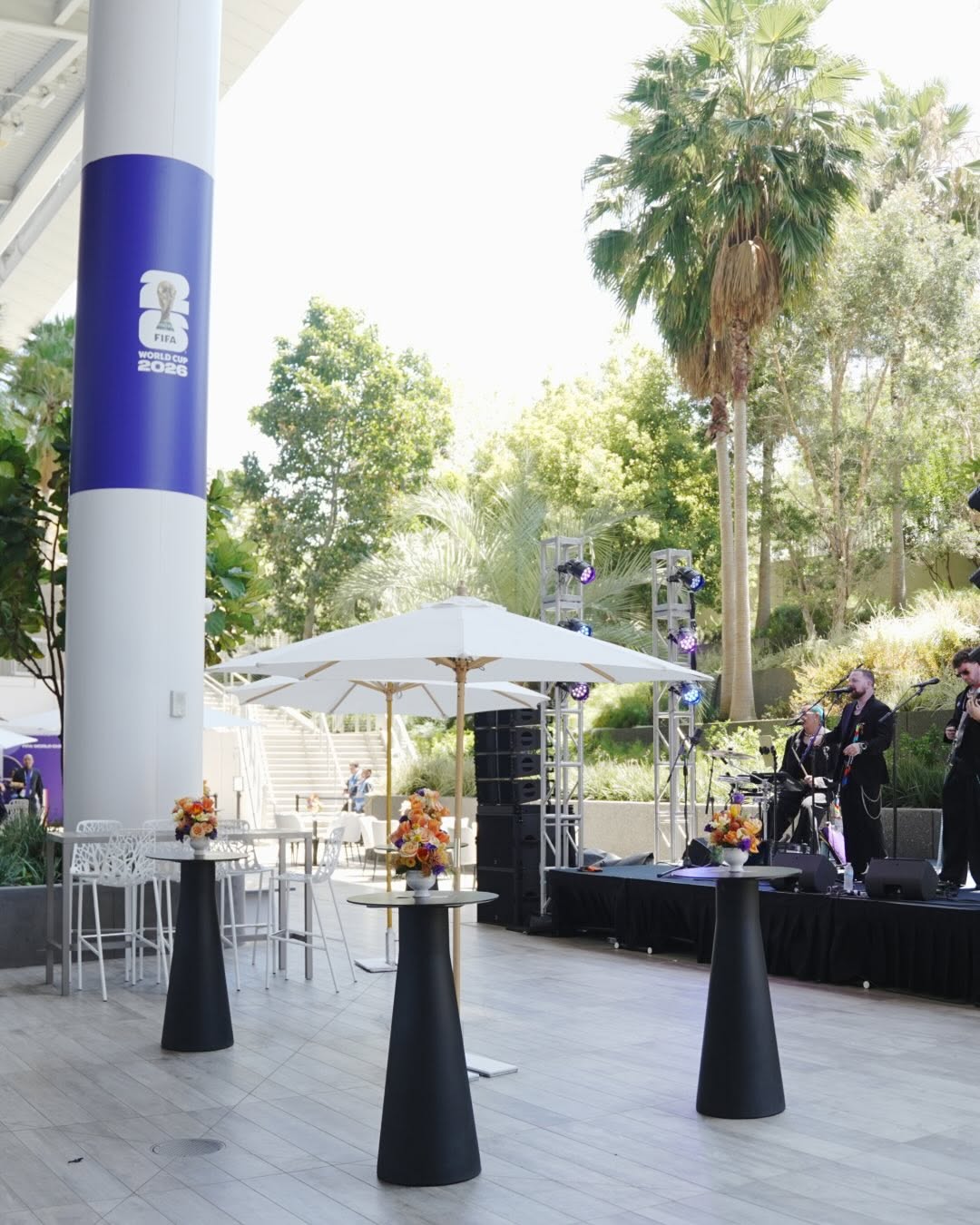 FIFA World Cup hospitality terrace with branded architectural columns and live music